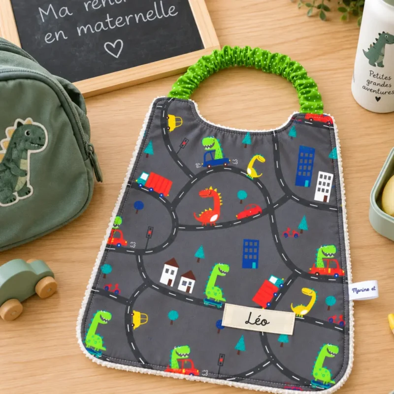 Bavoir élastique maternelle dinosaure