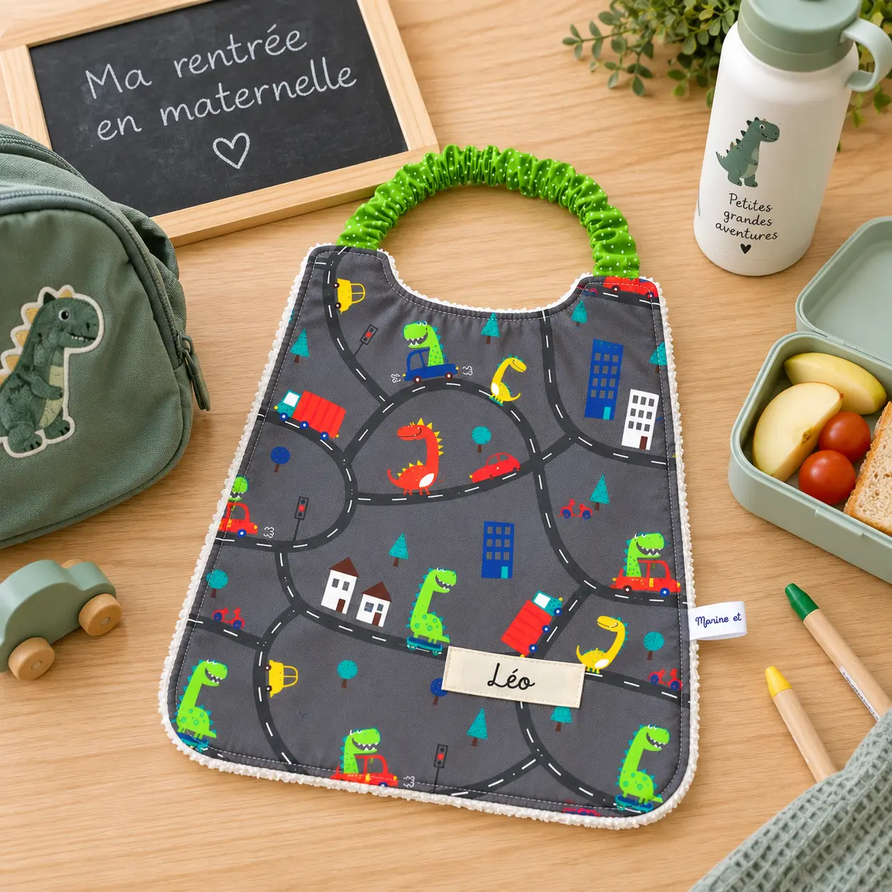 Bavoir élastique maternelle dinosaure